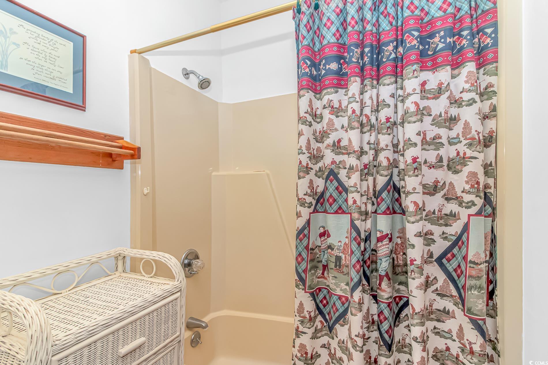 1417 Inlet Street Sunset Beach, NC 28468 - Photo 25 of 36 Bathroom with shower / tub combo with curtain