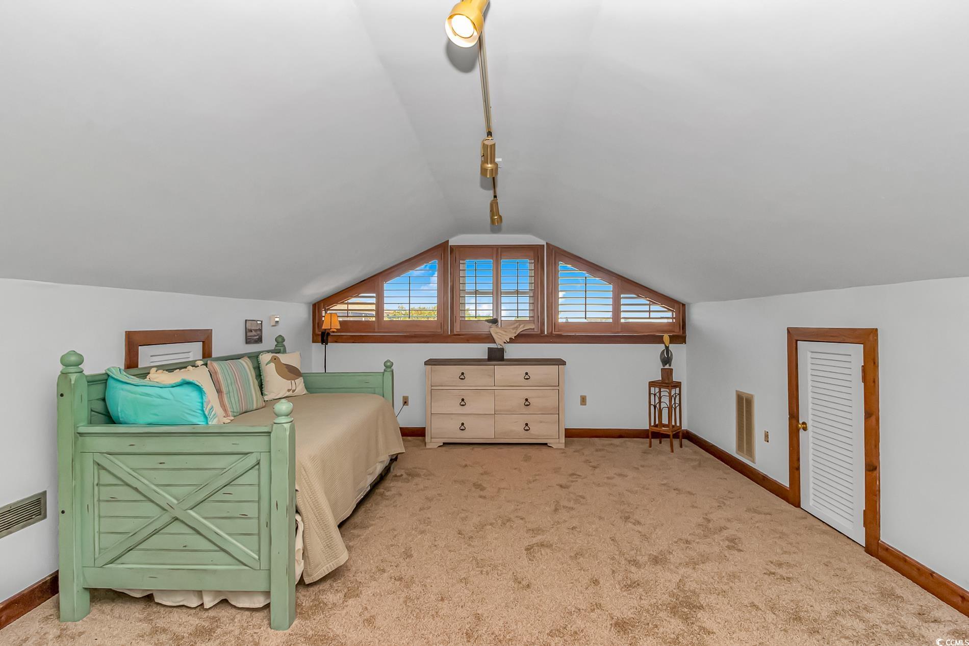 1417 Inlet Street Sunset Beach, NC 28468 - Photo 28 of 36 Bedroom featuring vaulted ceiling and light colore