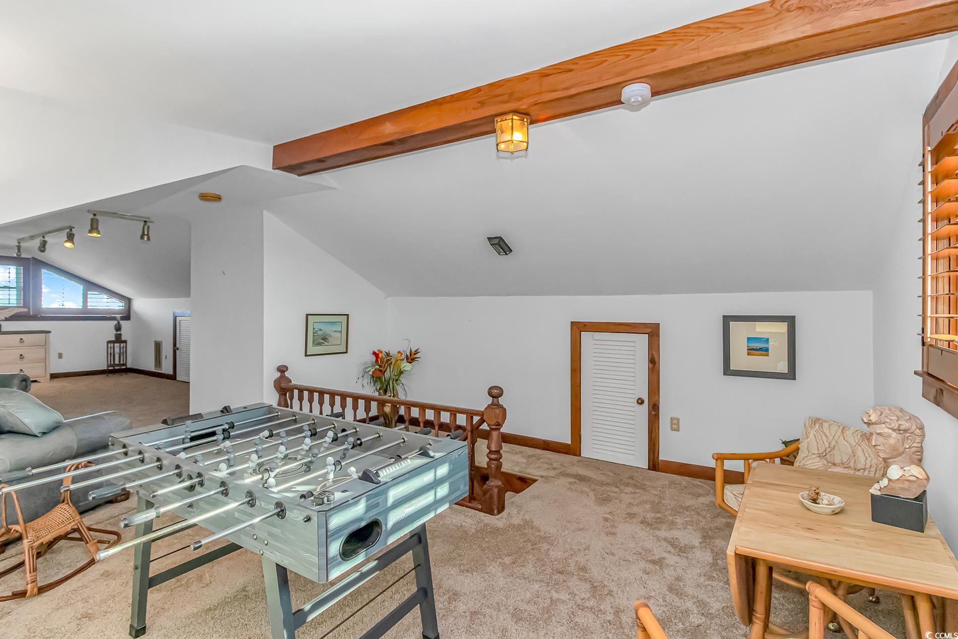 1417 Inlet Street Sunset Beach, NC 28468 - Photo 31 of 36 Recreation room featuring lofted ceiling with beam
