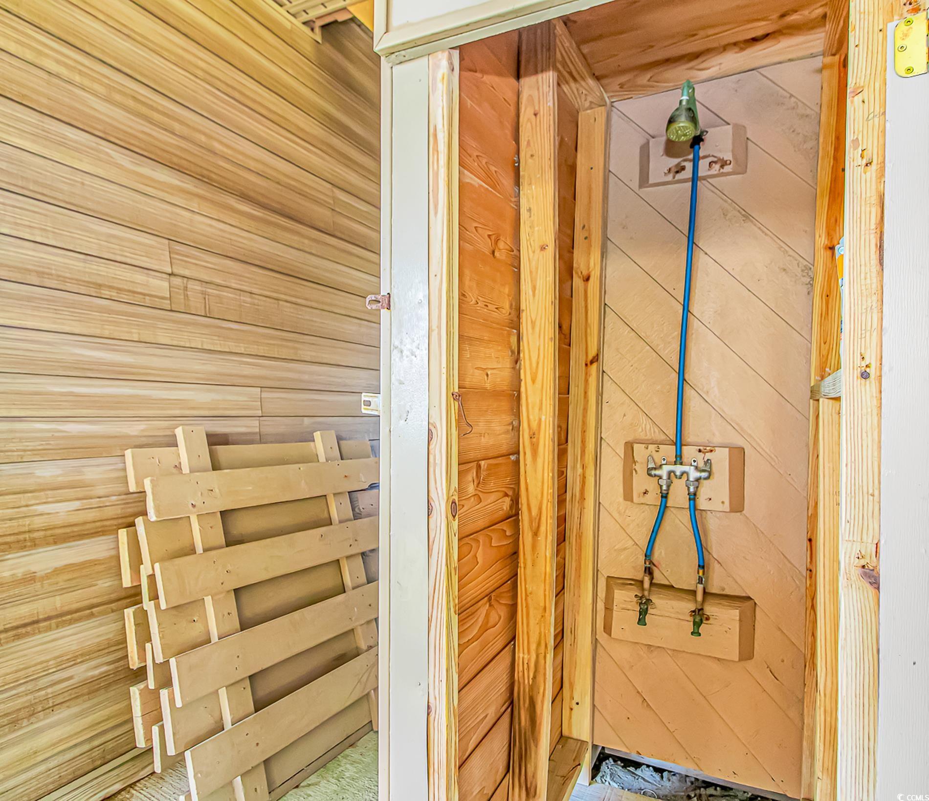 1417 Inlet Street Sunset Beach, NC 28468 - Photo 32 of 36 Bathroom featuring wood walls