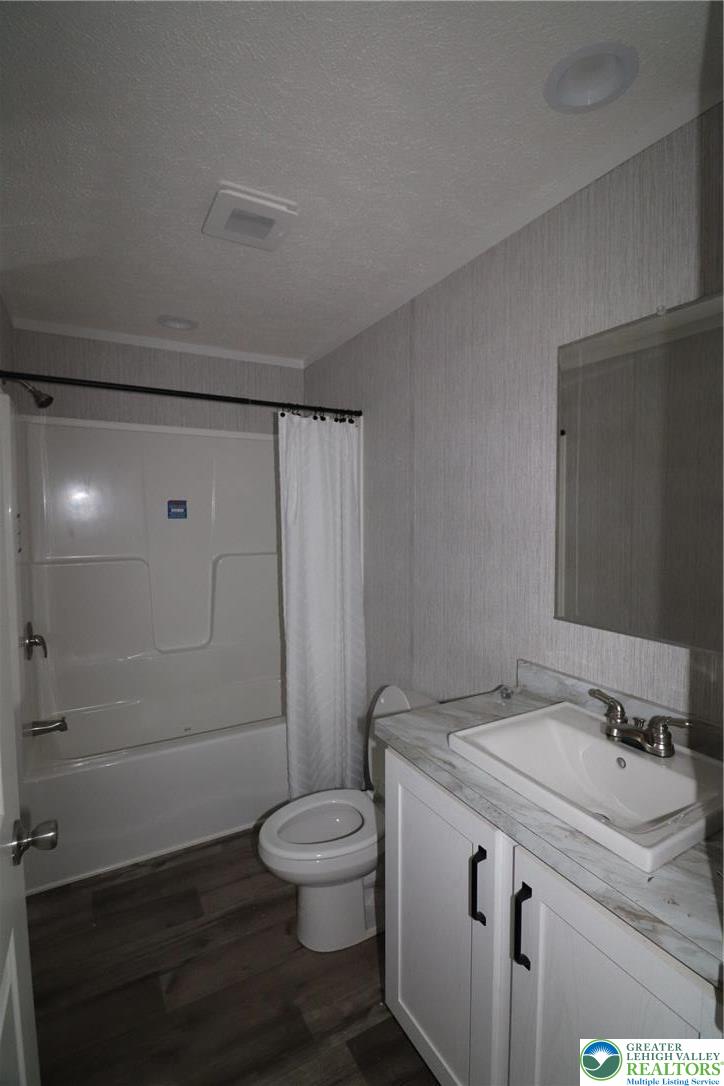 5020 Old Timber Road Stroudsburg, PA 18360 - Photo 21 of 32 a bathroom with a granite countertop sink toilet and shower