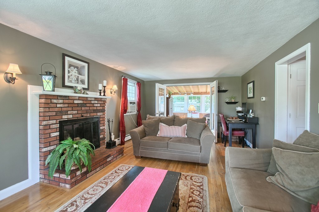 46 Charme Road Billerica, MA 01821 - Photo 17 of 30 a living room with furniture and a fireplace