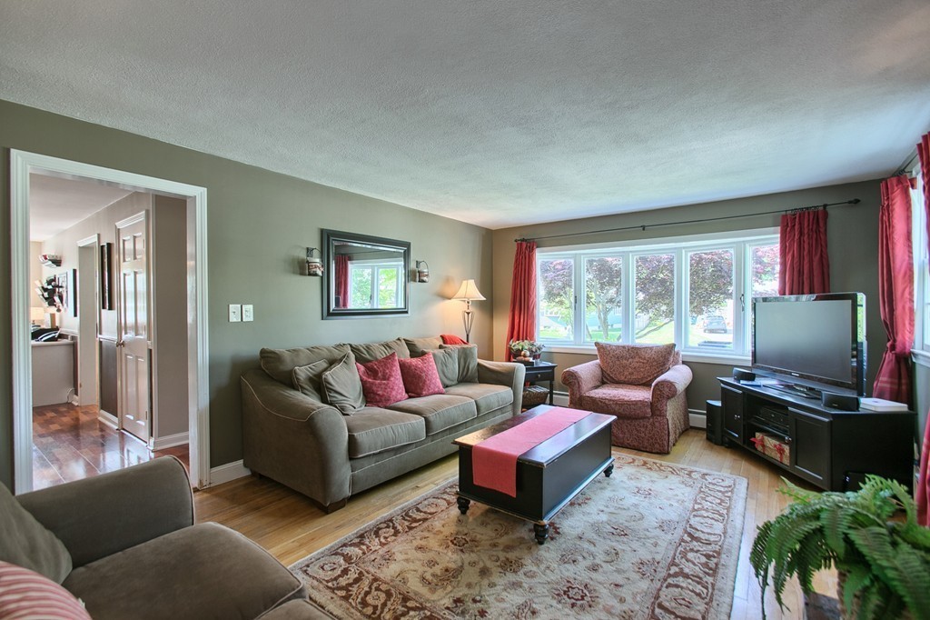 46 Charme Road Billerica, MA 01821 - Photo 18 of 30 a living room with furniture and a flat screen tv