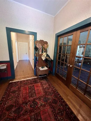 a view of a living room and wooden floor