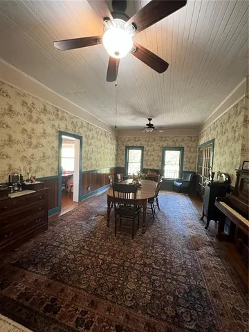 a living room with furniture rug and window