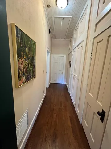 a living room with furniture rug and a window