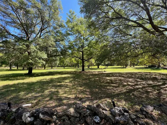 a view of a lake with a yard
