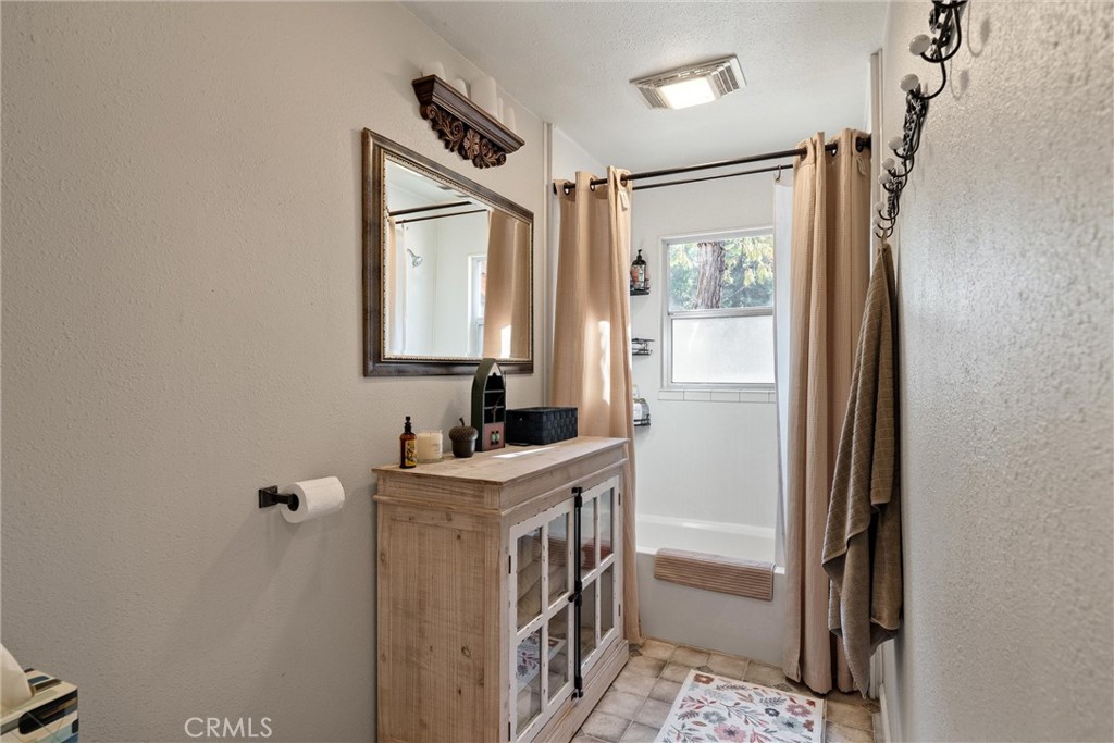 7554 Humboldt Road Butte Meadows, CA 95942 - Photo 10 of 41 a bathroom with a sink a mirror and a shower