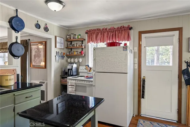 a view of a hallway with furniture and closet