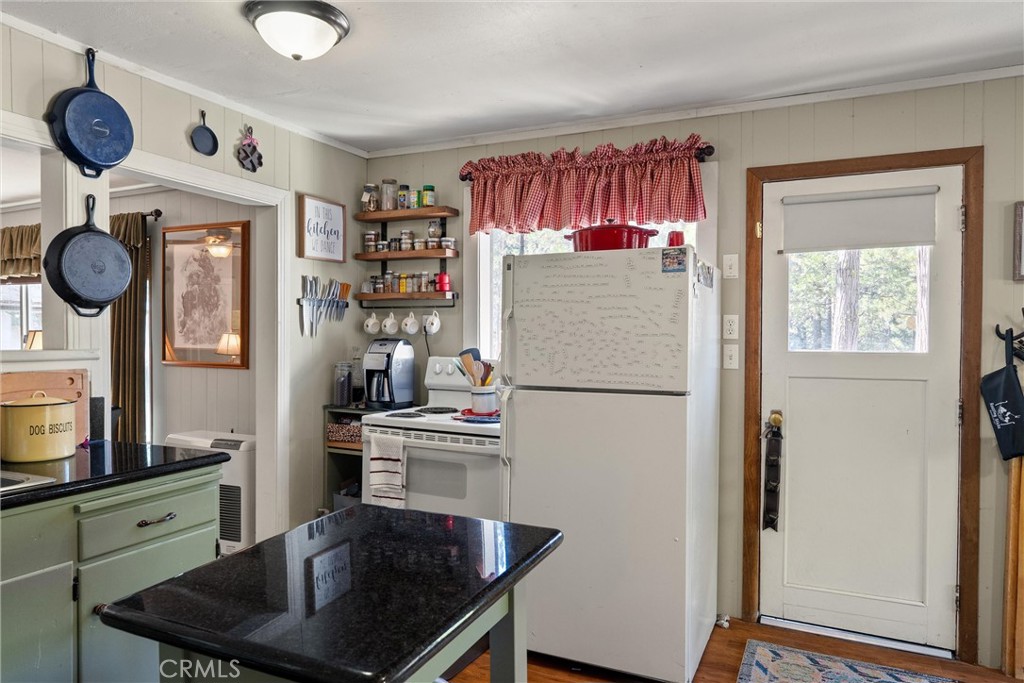 7554 Humboldt Road Butte Meadows, CA 95942 - Photo 13 of 41 a kitchen with stainless steel appliances granite countertop a refrigerator and a stove