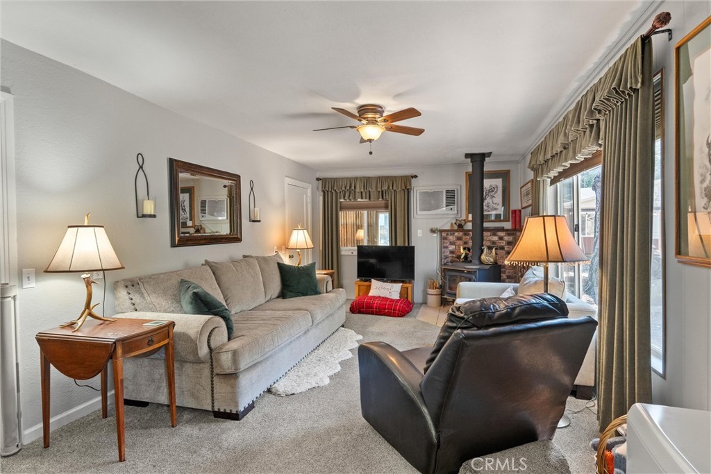 7554 Humboldt Road Butte Meadows, CA 95942 - Photo 18 of 41 a living room with furniture and a lamp