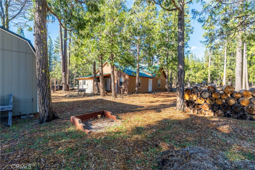 7554 Humboldt Road Butte Meadows, CA 95942 - Photo 28 of 41 a view of a yard with plants and trees