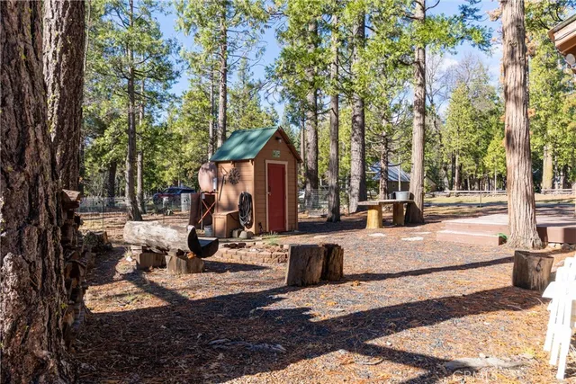 a view of a backyard with sitting area