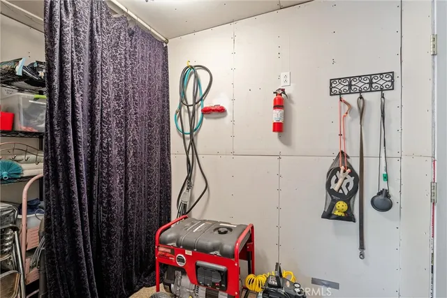 a utility room with a lot of stuff and washer
