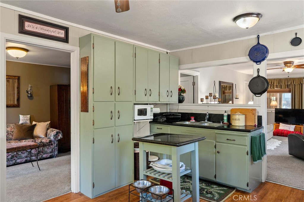 7554 Humboldt Road Butte Meadows, CA 95942 - Photo 4 of 41 a kitchen with a sink cabinets and wooden floor
