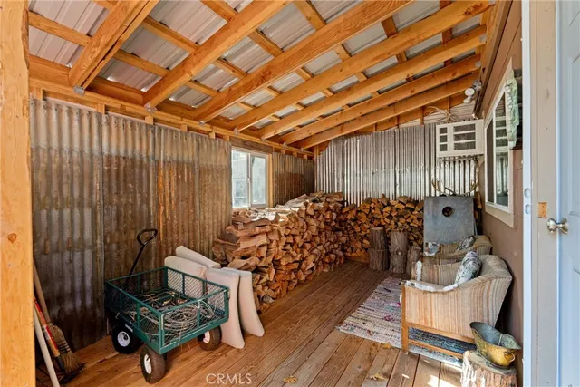 a view of a chairs in wooden deck