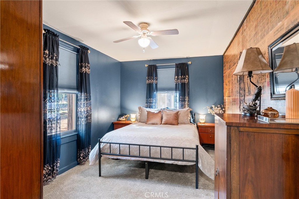 7554 Humboldt Road Butte Meadows, CA 95942 - Photo 7 of 41 a bed room with a bed and a chandelier