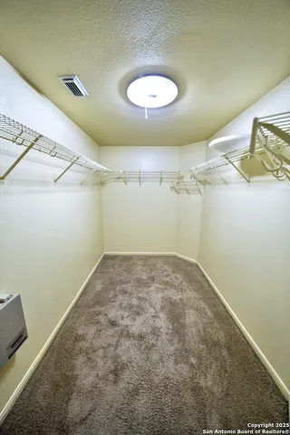 an empty room with a empty space and a window