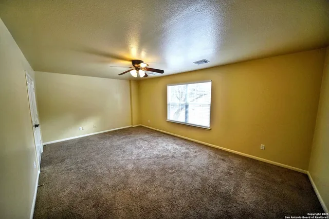 an empty room with a empty space and a window