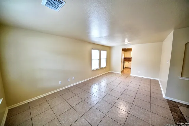 a view of an empty room and window