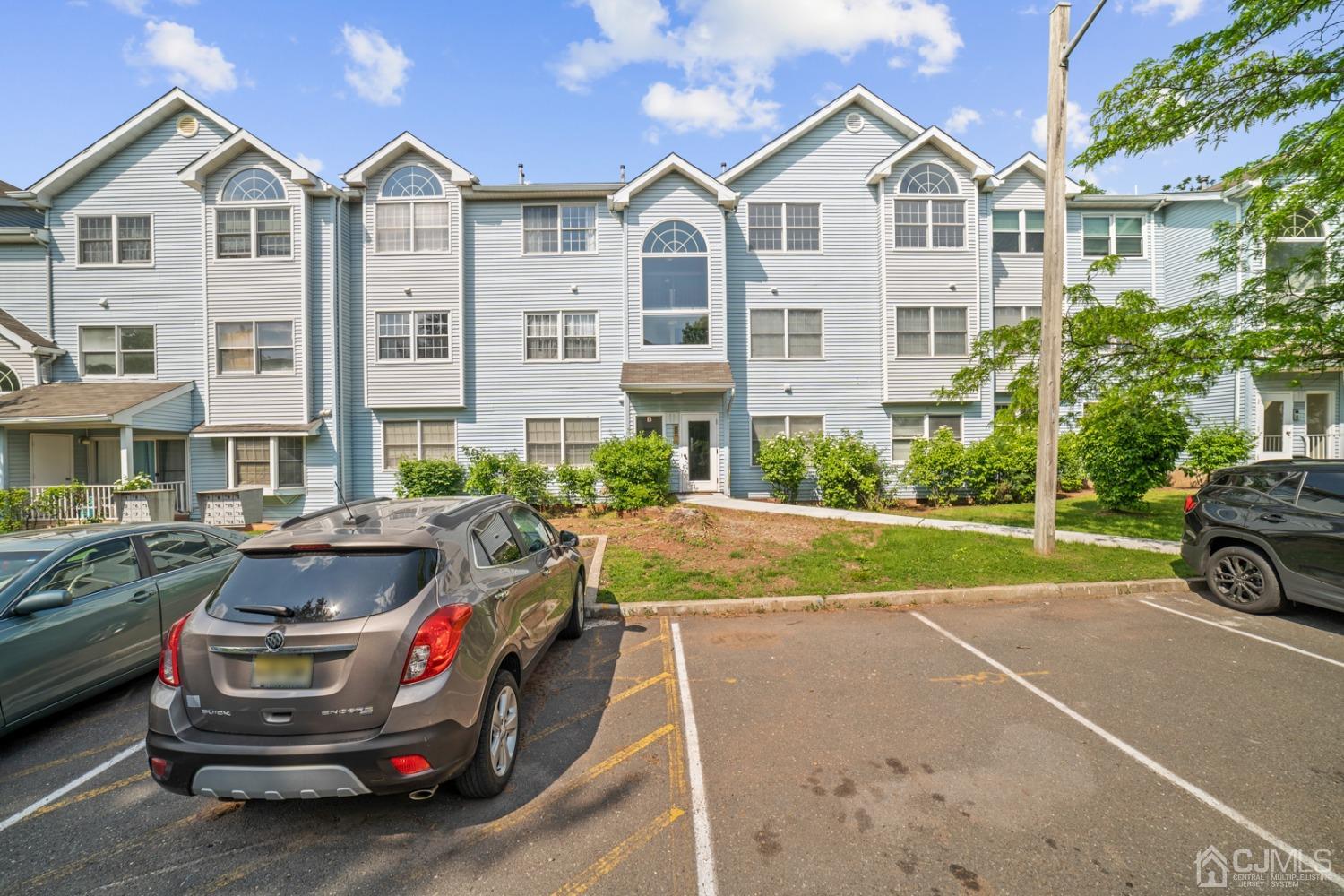 133 Edpas Road New Brunswick, NJ 08901 - Photo 1 of 17 a view of a white house and a yard in front of it