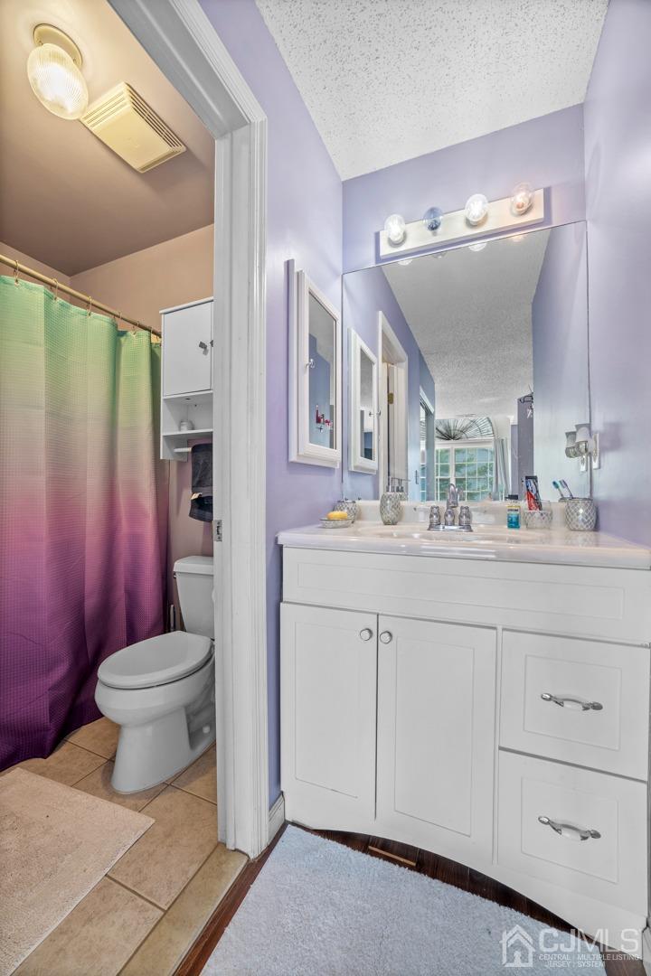 133 Edpas Road New Brunswick, NJ 08901 - Photo 11 of 17 a bathroom with a sink toilet and shower