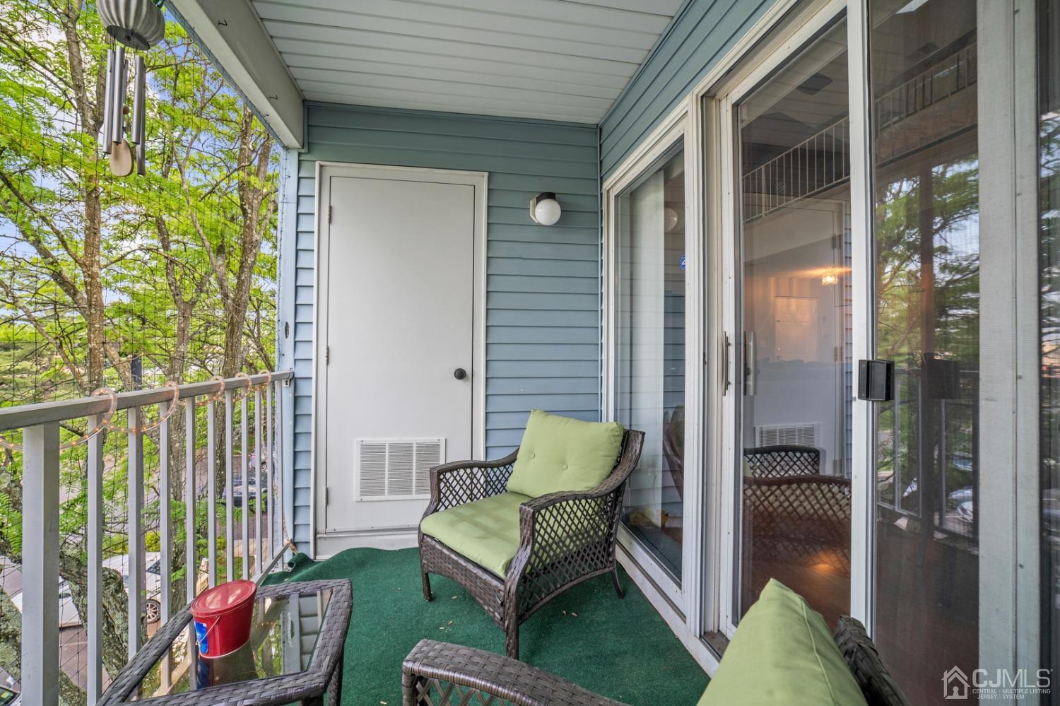 133 Edpas Road New Brunswick, NJ 08901 - Photo 17 of 17 a balcony with furniture and a potted plant