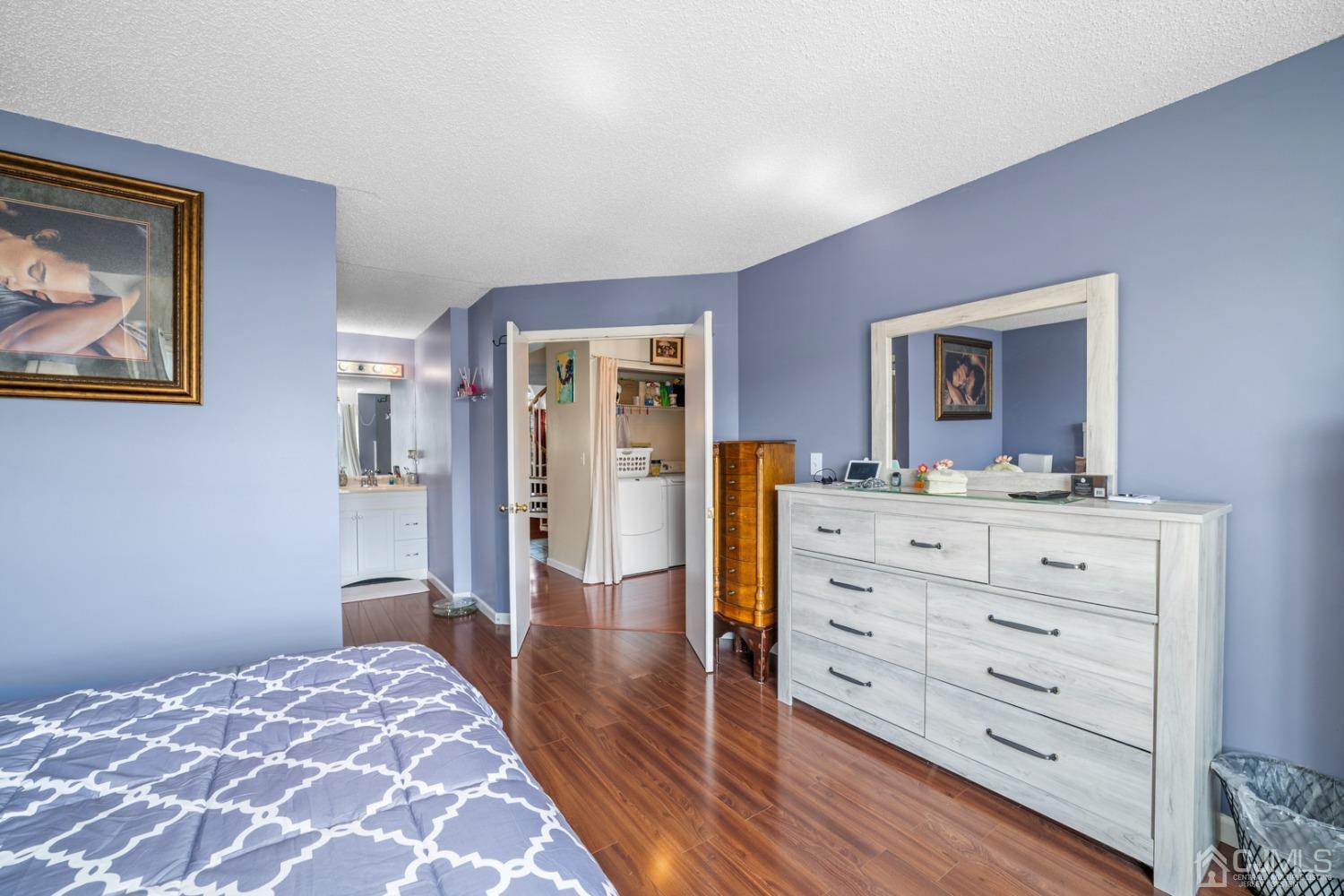 133 Edpas Road New Brunswick, NJ 08901 - Photo 10 of 17 a bedroom with a bed and a dresser in it