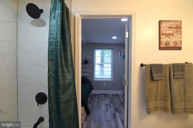 a bathroom with a glass shower door