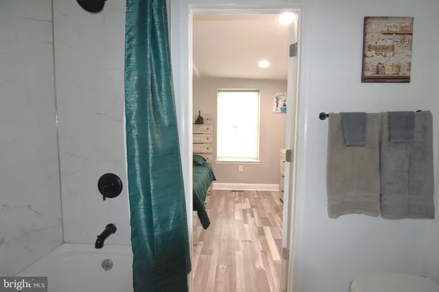 a white toilet sitting next to a bathroom sink