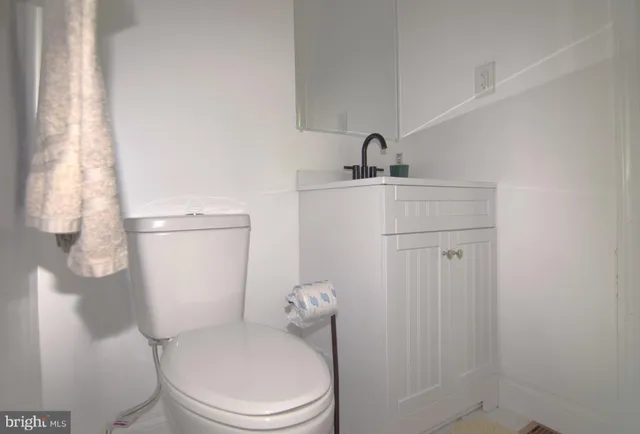 a bedroom with a bed and a television