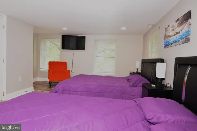 a bedroom with a bed and a closet