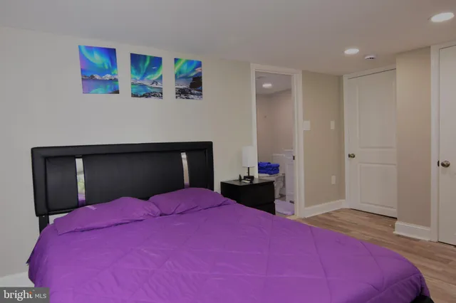 a bedroom with a bed and a dresser