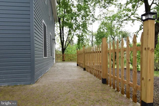 a backyard of a house with lots of trees