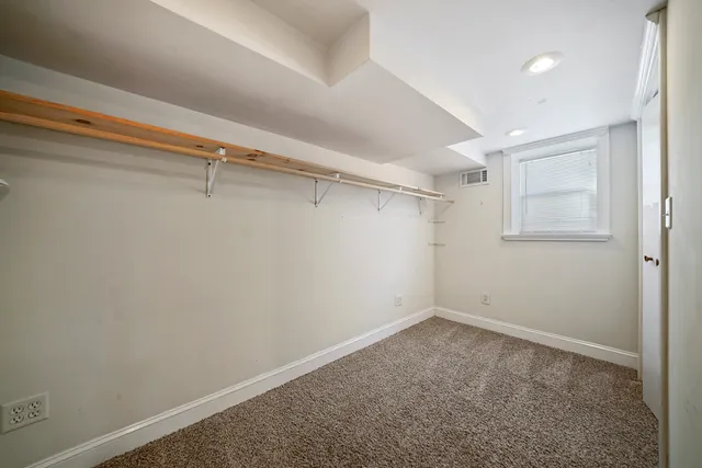 a view of a room with racks on the wall