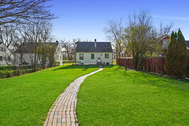 a view of a park with large trees