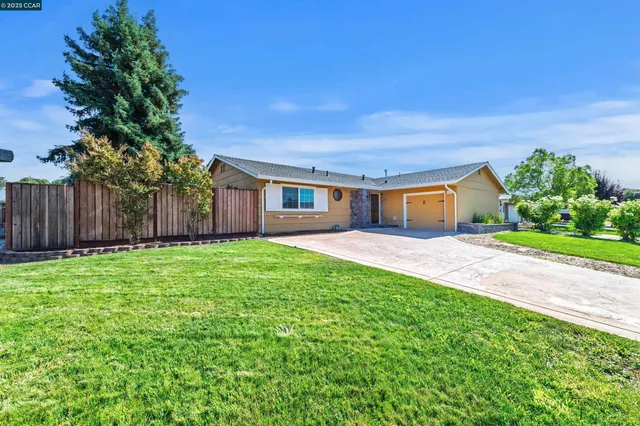 a house view with a garden space