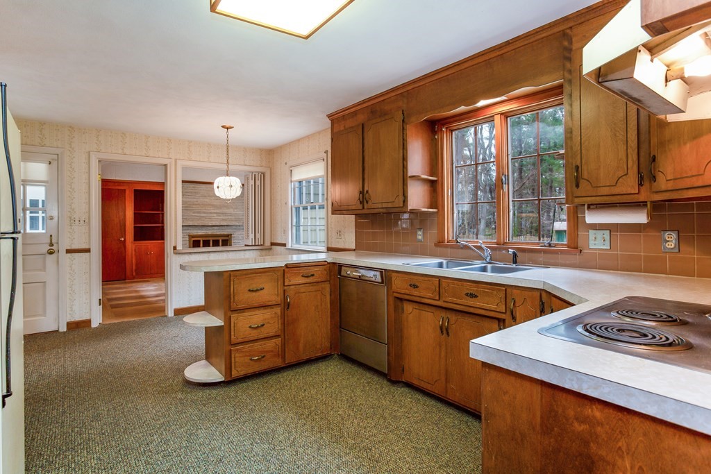 143 Viscount Road Longmeadow, MA 01106 - Photo 6 of 30 a kitchen with a stove a sink and a refrigerator