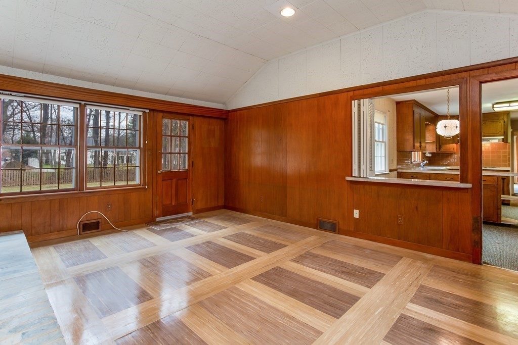 143 Viscount Road Longmeadow, MA 01106 - Photo 8 of 30 a view of an empty room with a window and wooden floor