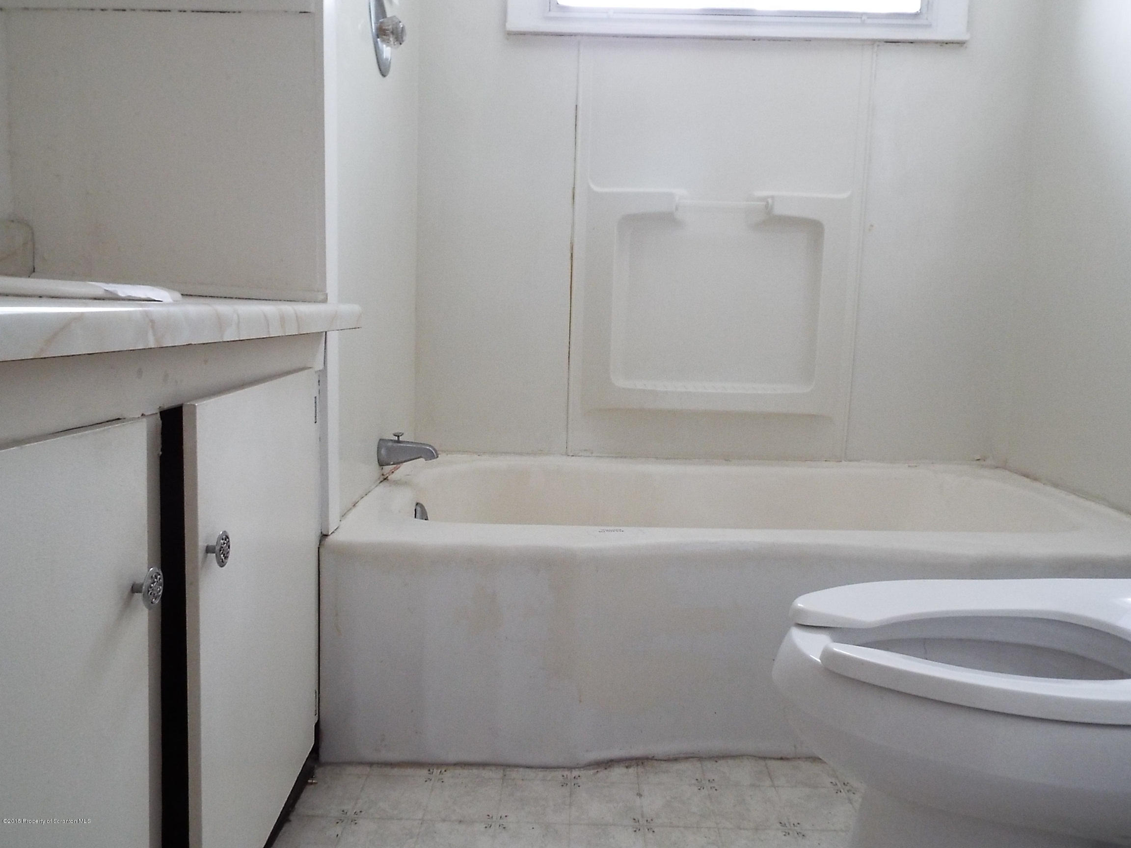 24 Rutz Street Ashley, PA 18706 - Photo 12 of 13 a bathroom with a bathtub and a toilet