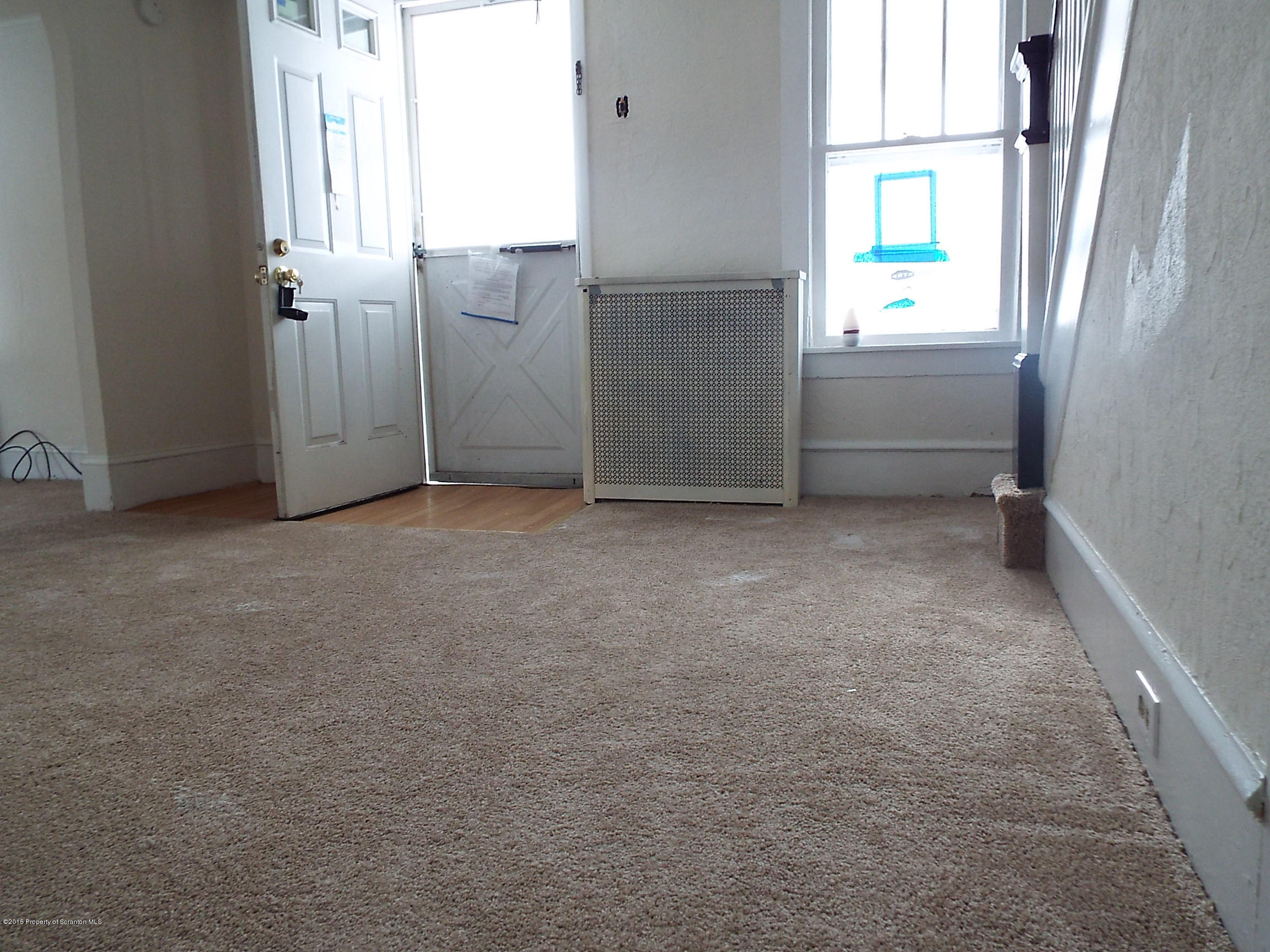 24 Rutz Street Ashley, PA 18706 - Photo 9 of 13 an empty room with windows