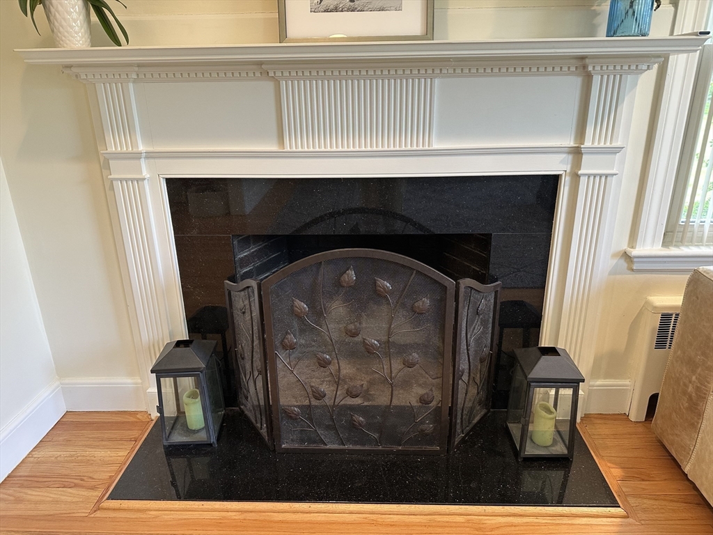 45 Wellesley Road Belmont, MA 02478 - Photo 14 of 39 a closeup of a fireplace