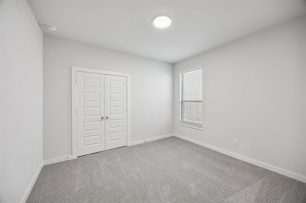 2102 Sunshining Road Princeton, TX 75407 - Photo 28 of 38 Bedroom in the Wimbledon home plan by Trophy Signature Homes – REPRESENTATIVE PHOTO