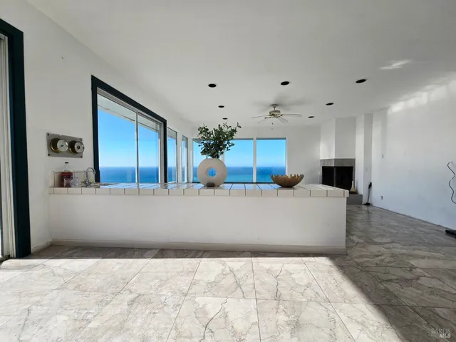 an aerial view of a houses with a yard