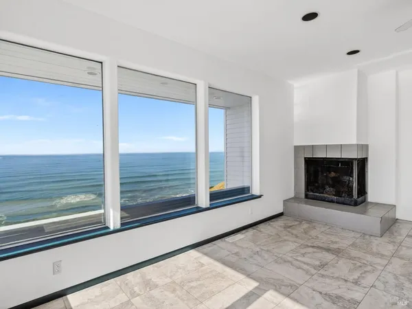 a view of living room with granite countertop furniture and fireplace