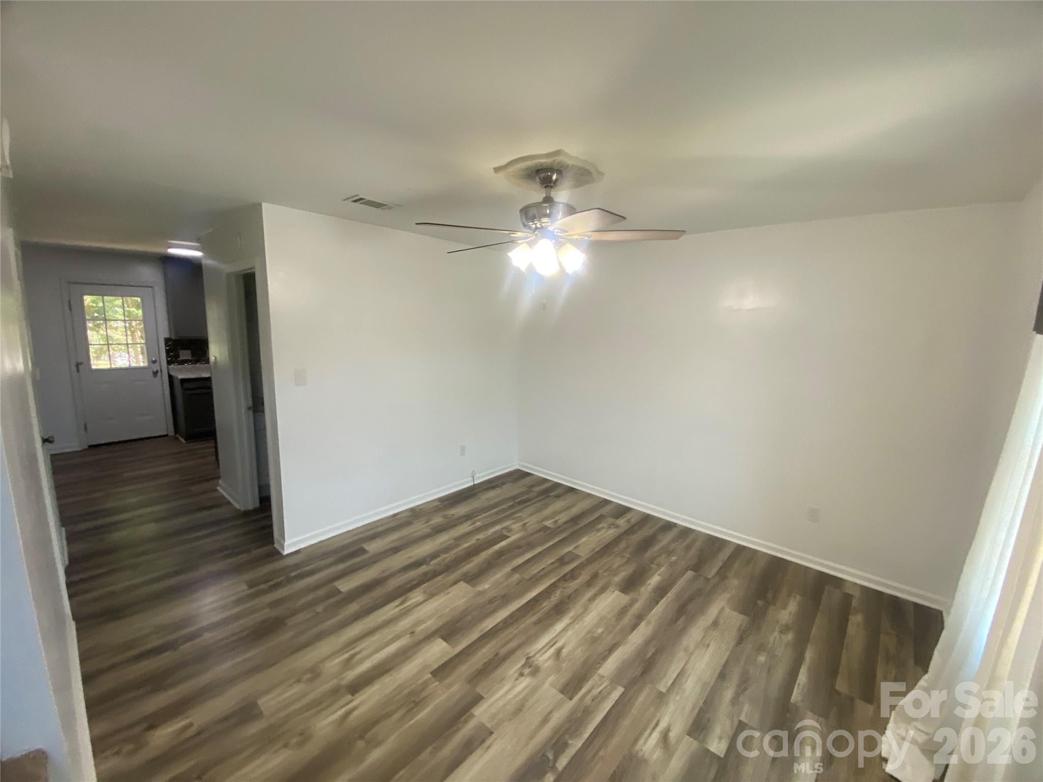 788 Coley Road Salisbury, NC 28146 - Photo 8 of 43 wooden floor in an empty room with a window