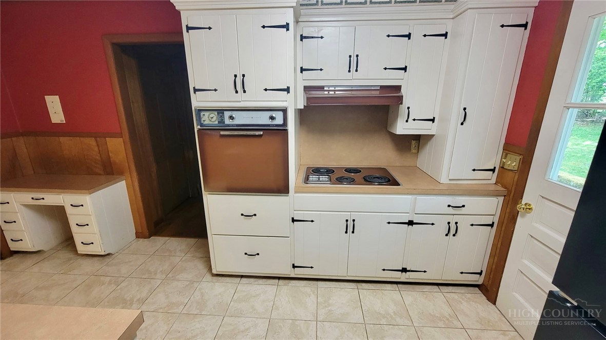 247 Crest Drive Boone, NC 28607 - Photo 5 of 19 a kitchen with stainless steel appliances a stove and a refrigerator