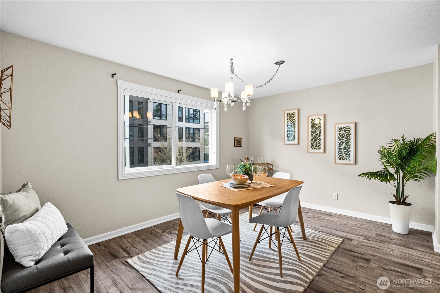 8720 Phinney Avenue North, Unit 11 Seattle, WA 98103 - Photo 12 of 28 a view of a dining room with furniture window and wooden floor