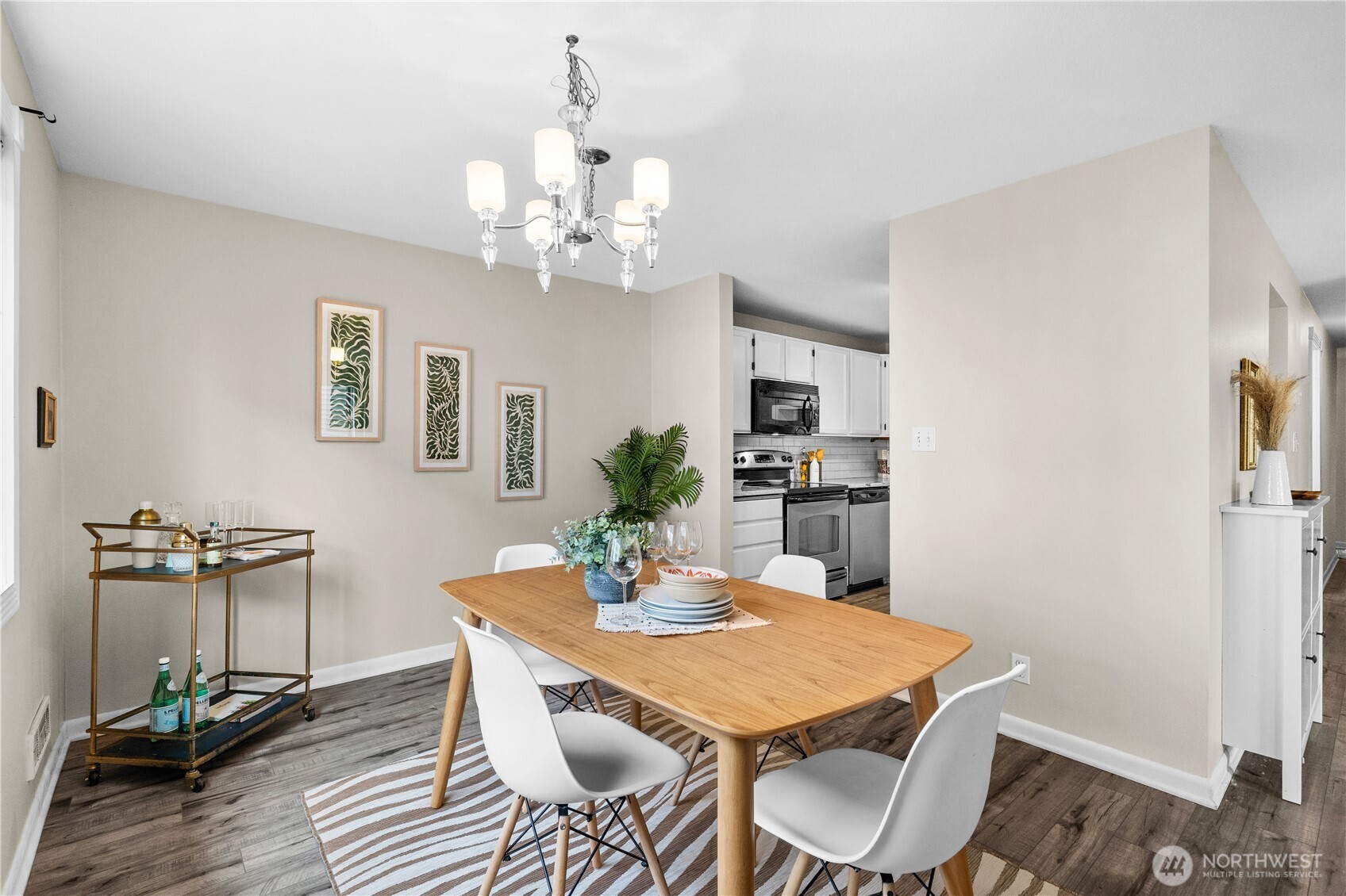 8720 Phinney Avenue North, Unit 11 Seattle, WA 98103 - Photo 14 of 28 a view of a dining room with furniture and wooden floor