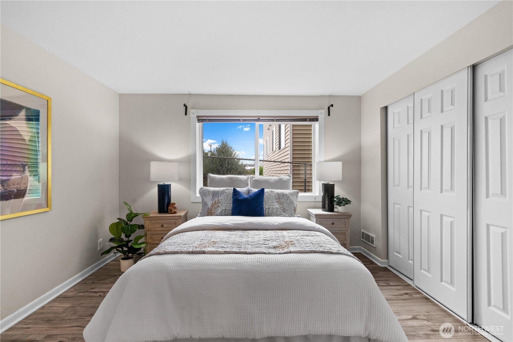 8720 Phinney Avenue North, Unit 11 Seattle, WA 98103 - Photo 15 of 28 a bedroom with a large bed and a window